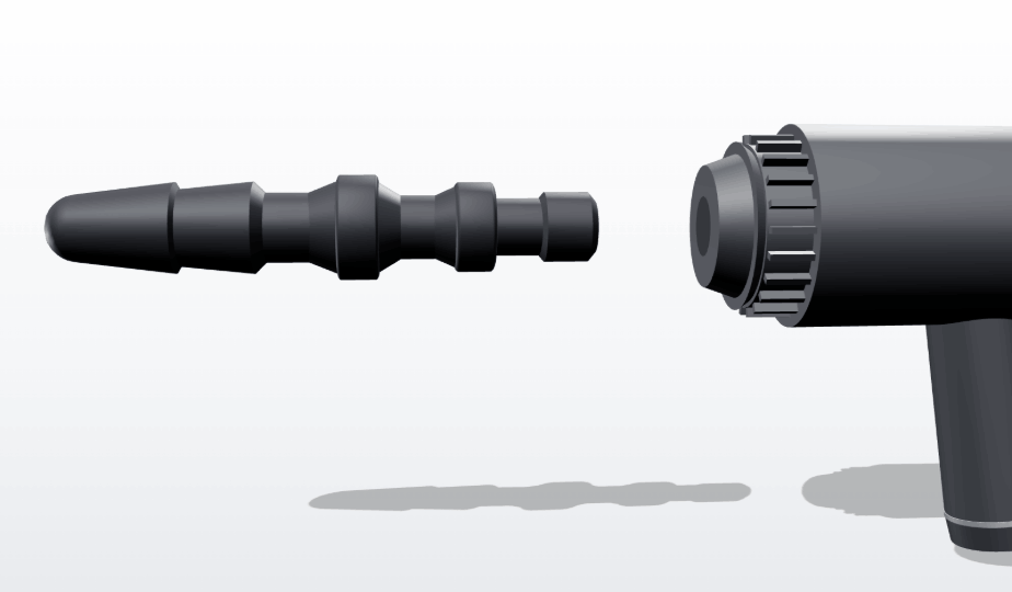 Inserting adapter into massage gun